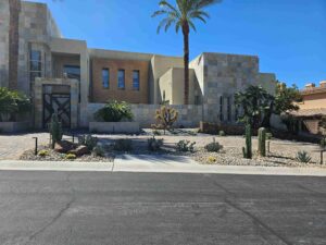 desert front yard landscaping with palm trees, cactus and stone hardscape in Las Vegas Nevada by FreshStart Landscaping