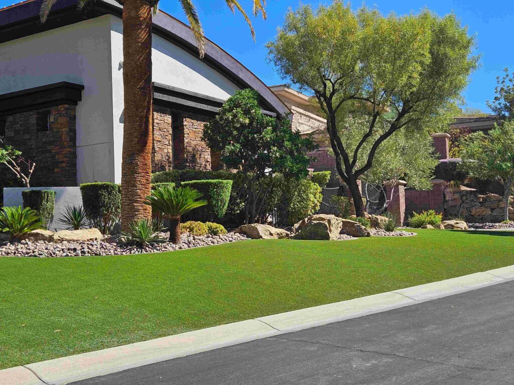 front yard landscaping with artificial turf and desert plants in Las Vegas